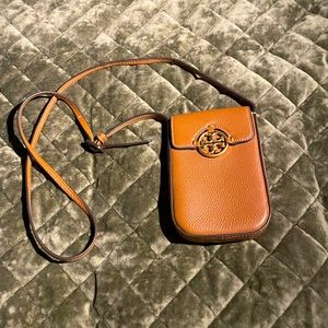 Tory Burch phone case. If it doesn’t sell, I am going to use it. Chic!